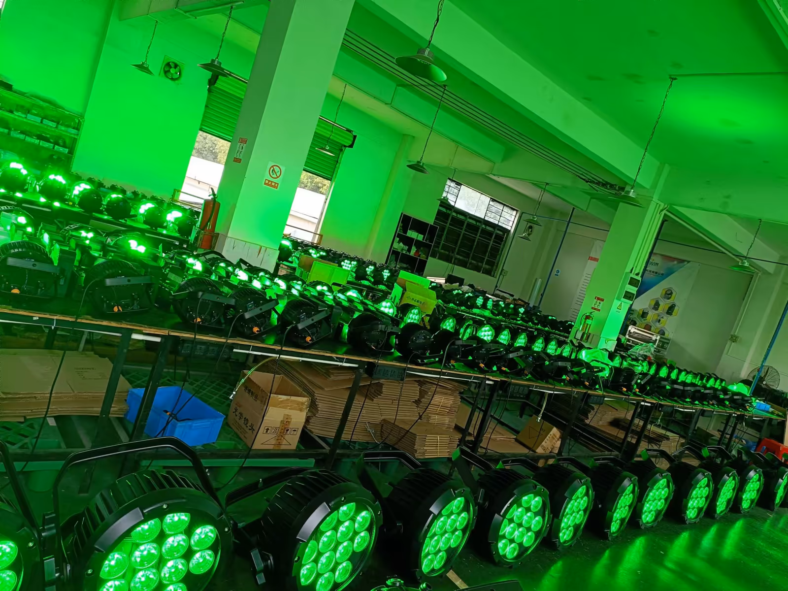 Rows of LumiUp battery PAR lights powered on for batch inspection